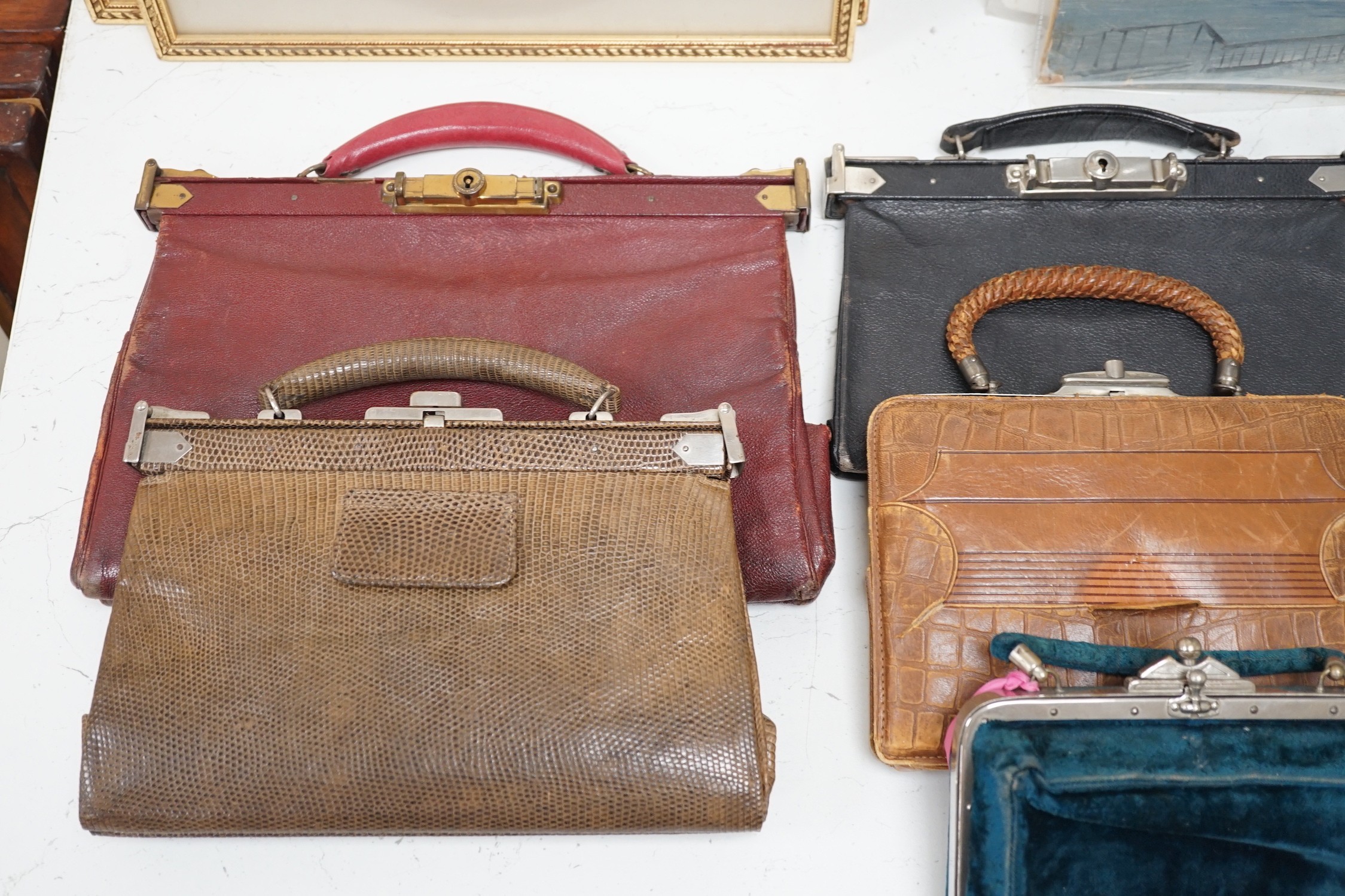 A collection of nine late 19th century to 1940’s mixed leather ladies handbags with ‘Doctors bag’ style metal clasps